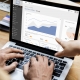 Business dashboard on laptop screen showing charts and analytics