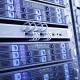Close-up view of server racks in a modern data center with network cables and blue indicator lights