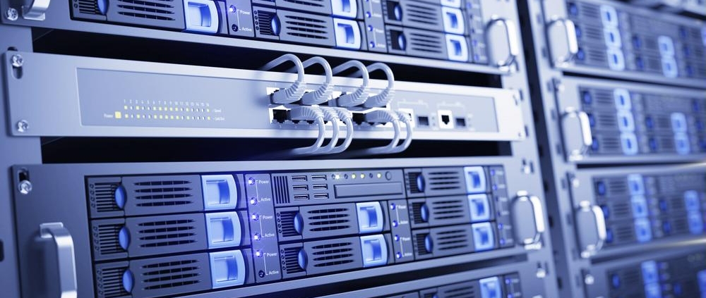Close-up view of server racks in a modern data center with network cables and blue indicator lights